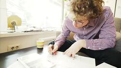 Young men working using a digital tablet and blue prints. Stock Footage