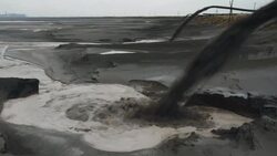 Panoramic view left to right across the radioactive toxic tailings lake at the rear of the Baogang Iron and Steel plant in Baotou China The lake is full of heavy metals and rare earths and over 10km wide Stock Footage