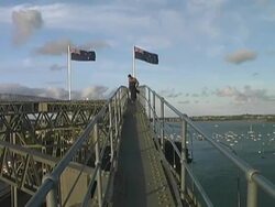 New Zealand: Man Atop Auckland Harbour Bridge After Climb Stock Footage