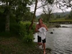 MS Man walking away from river edge / Boquia, Quindio, Colombia Stock Footage