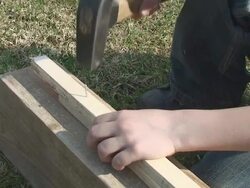 Hammer in child arms Stock Footage