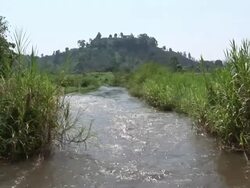 The view of the river in front of a mountain Stock Footage