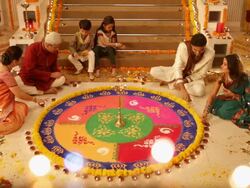 Family preparing rangoli in diwali festival Stock Footage