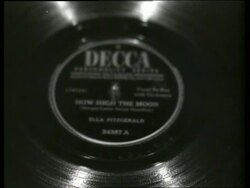 B/W close up of Ella Fitzgerald 78 rpm record spinning Stock Footage