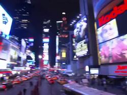 Jumbo billboards flash above busy streets in Times Square. Stock Footage