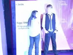 Justin Bieber's Wax figure and his Biggest Fan at Madame Tussauds Hollywood & Justin Bieber's Biggest Fan Unveil New Bieber Figure On Singer's 18th Birthday 03/01/12 Stock Footage