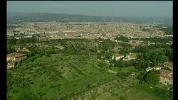 Mansions top a hill over the cityscape of Florence, Italy. Stock Footage