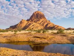WS DS Beautiful Cloudscape Over Spitzkoppe Mountain Stock Footage