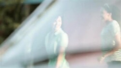 Excited friends in classic convertible arrive at roadside motel Stock Footage