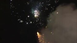Fireworks sparkle and crackle in the night sky. Stock Footage