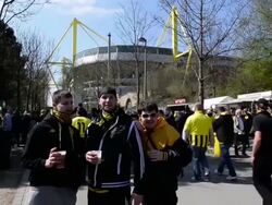 Mid shot of drunken fans singing. Signal Iduna Stock Footage