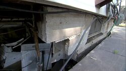 A washed out basement wall is evidence of the structural damage on a flooded building. Stock Footage