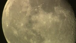 Wispy clouds drift past a full moon. Stock Footage