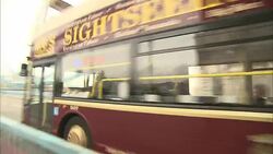 A tour bus crosses the Tower Bridge in London. Stock Footage