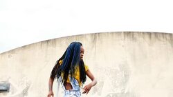 MS LA Woman dancing on rooftop of building Stock Footage