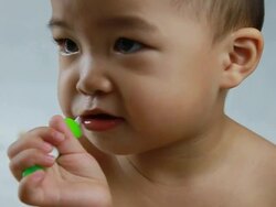 baby chewwing toothbrush Stock Footage
