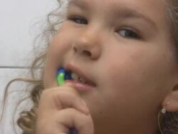 Girl brushing her teeth (HD) Stock Footage
