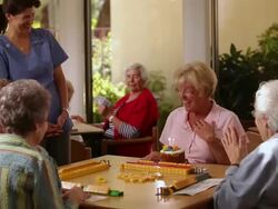 "MS PAN Care giver bringing birthday cake to senior citizen / Laguna Woods, CA, United States " Stock Footage
