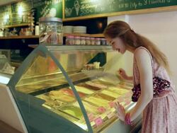 WS Teenage girl looking at ice cream in a ice cream shop. Stock Footage