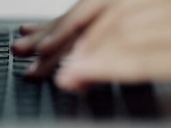 Woman typing on laptop Stock Footage