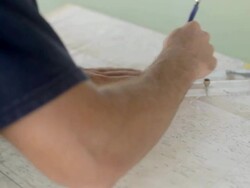 MS Shot of Boat captain plotting couse on navigational chart / Socorro Islands, Mexico Stock Footage