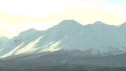 Clouds race over snowy mountains. Stock Footage
