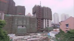 Scaffolding surrounds buildings at a construction site near No. 9 Hotel in Shanghai, China. Stock Footage