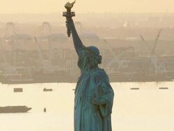 Close up aerial view of Statue of Liberty in the late afternoon Stock Footage