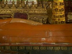 Pan Left Shot Reveal Reclining Buddha in Wat Phnom Phnom Penh Cambodia Stock Footage