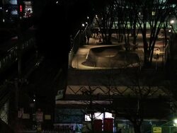 MS Shot of JR trains and Skateboard park and Shibuya station at night / Shibuya, Tokyo, Japan  Stock Footage