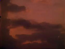 T/L clouds pass right to left at dusk. Stock Footage