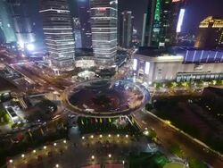 Aerial Timelapse, roundabout Pudong, night, traffic, city lights, Shanghai International Finance Centre, Shanghai, China Stock Footage