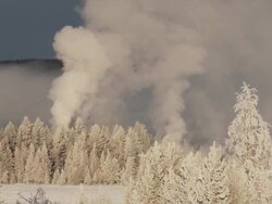 WS PAN Snow field with geothermal activity / Yellowstone National Park, Wyoming, United  Stock Footage