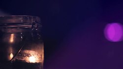 Candle lit on a pink background Stock Footage