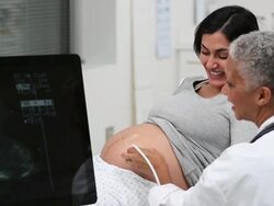 MS DS Doctor Performing Sonogram on Pregnant Woman / Richmond, Virginia, USA Stock Footage
