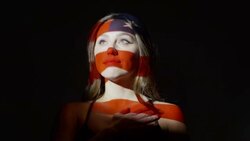 Close up slow motion shot of American flag projections on face of woman / Cedar Hills, Utah, United States Stock Footage
