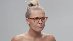 Portrait of Young, Blond, Cheerful Woman Trying New Glasses And Making Faces Stock Footage