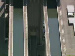 MS AERIAL DS Tourist roaming at Canal and lifts for boat in canal / Walloon Region, Belgium Stock Footage