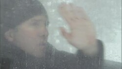 A wipes frost from the window of an SUV. Stock Footage