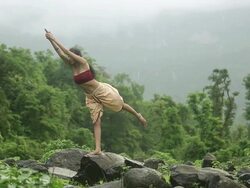 Young woman practicing yoga in the forest, Malshej Ghat, Maharashtra, India Stock Footage
