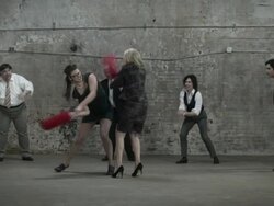 Two women fighting with pugil sticks Stock Footage