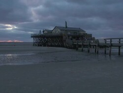 WS View of cafÃƒÂ© at beach side during sunset and clouds moving over, North Sea North Frisia, / St. Peter Ording, Schleswig Holstein, Germany Stock Footage