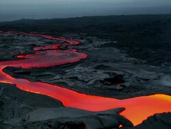 MS T/L Shot of molten lava flow going down lava plateau at early morning / Big Island, Hawaii, United States Stock Footage