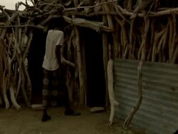 Afar man outside wooden hut Stock Footage