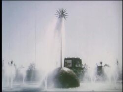 1964 side point of view past fountain with sculpture in center at NY World's Fair Stock Footage
