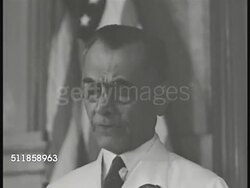 1939: COMMONWEALTH of the PHILIPPINES: LAWS: Legislative meeting in progress, VS President Manuel L. Quezon standing w/ legal papers, speaking (No SOT). Audience in light colored suits clapping, applauding. Instructional Video