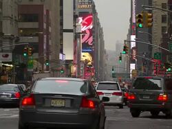 MS Yellow cabs, publicity panel and Pedestrian crossing on street / New York, United States Stock Footage