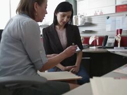 Doctor talking with patient in office Stock Footage