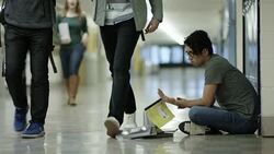 Young adult males bullying another student Stock Footage