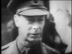 B/W 1940 close up King George VI in uniform talking to man in foreground / London / educational Stock Footage